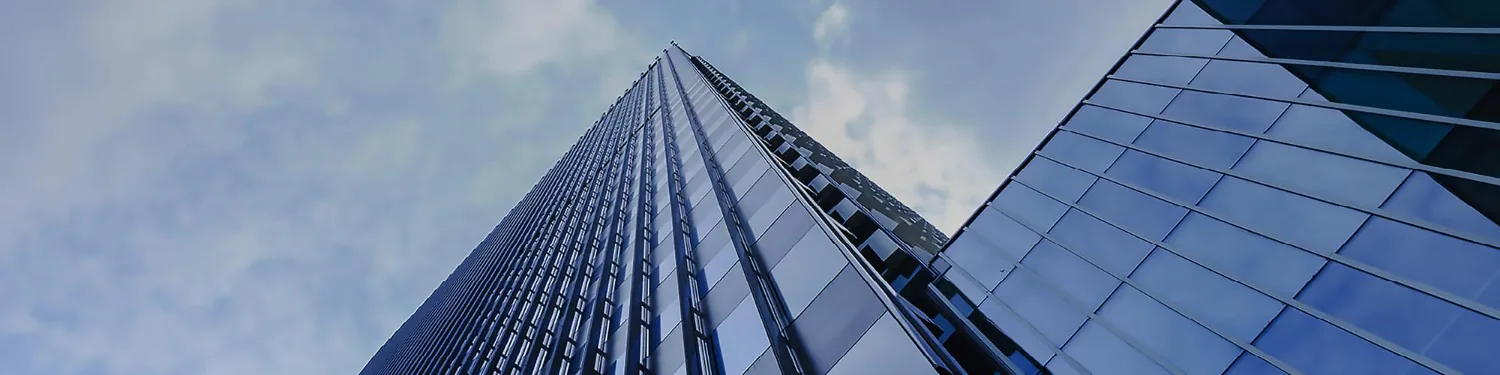 Glass curtain wall rising against the sky